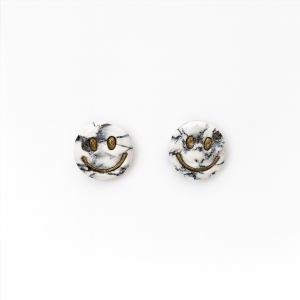 Handmade polymer clay howlite effect smiley earrings with gold leaf and glossy stone-effect finish.