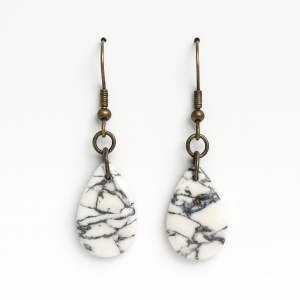 Handmade polymer clay howlite effect droplet earrings with gold leaf and glossy stone-effect finish.