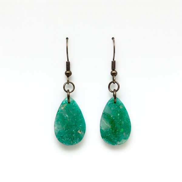 Handmade Opal Effect Droplet Earrings with green and teal marbled polymer clay and iridescent flecks on antique bronze fishhooks