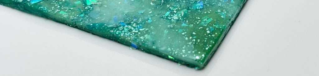 translucent green and teal polymer clay marbled for handmade opal effect jewellery.