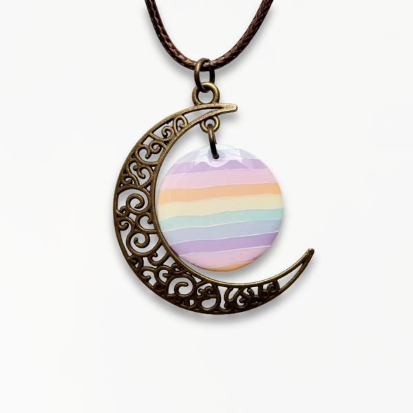 Handmade Pastel Glow Moon Necklace with pastel rainbow striped polymer clay pendant and antique bronze crescent moon charm.