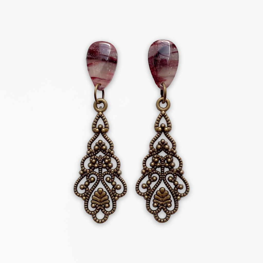Crimson Veil Filigree Earrings handcrafted from marbled polymer clay with intricate antique bronze detailing