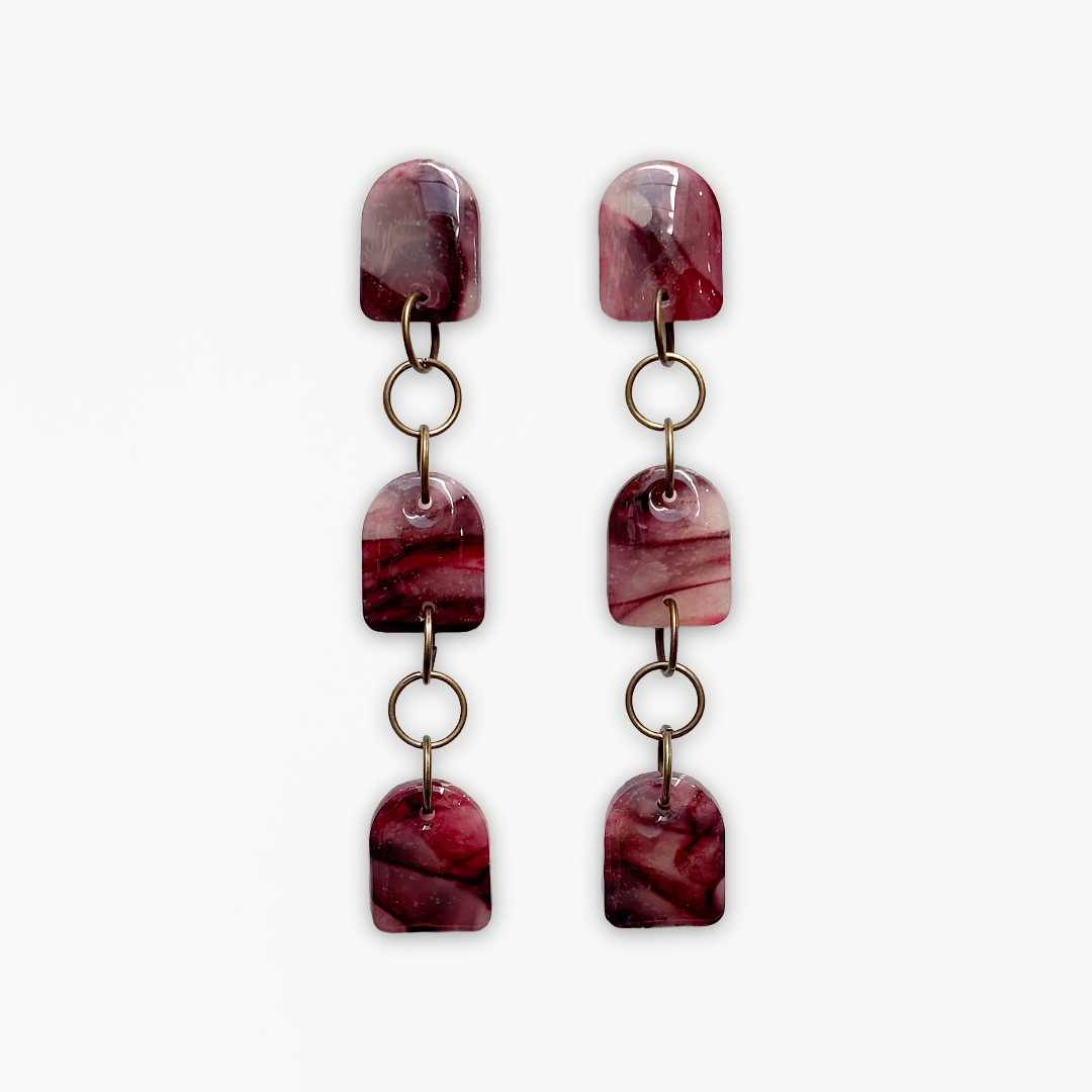 Crimson Veil Dangle Earrings handcrafted from marbled polymer clay with antique bronze detailing