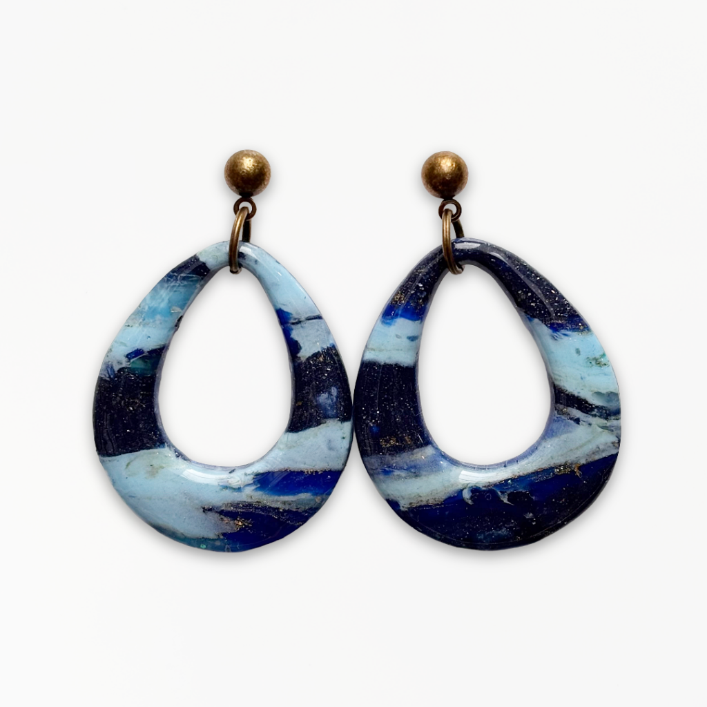 Handmade Deep Blue Teardrop Earrings featuring an open teardrop design in marbled navy, cobalt and turquoise polymer clay with antique bronze fittings.
