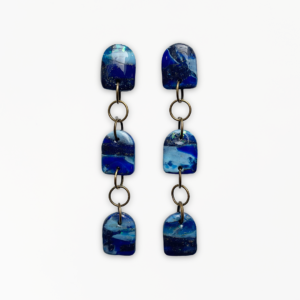 Handmade Deep Blue Dangle Earrings featuring a three-tier marbled navy, cobalt and turquoise polymer clay design with antique bronze connectors.